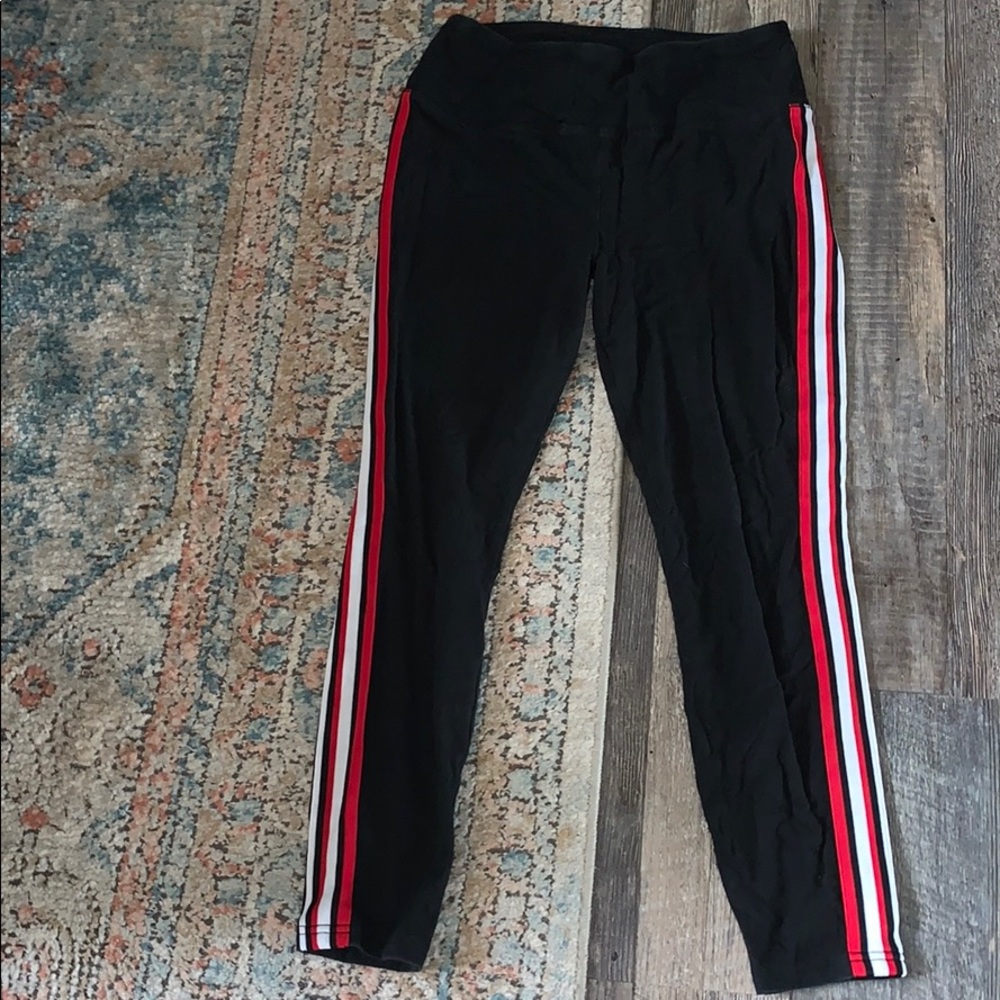 Black leggings with red and white stripes